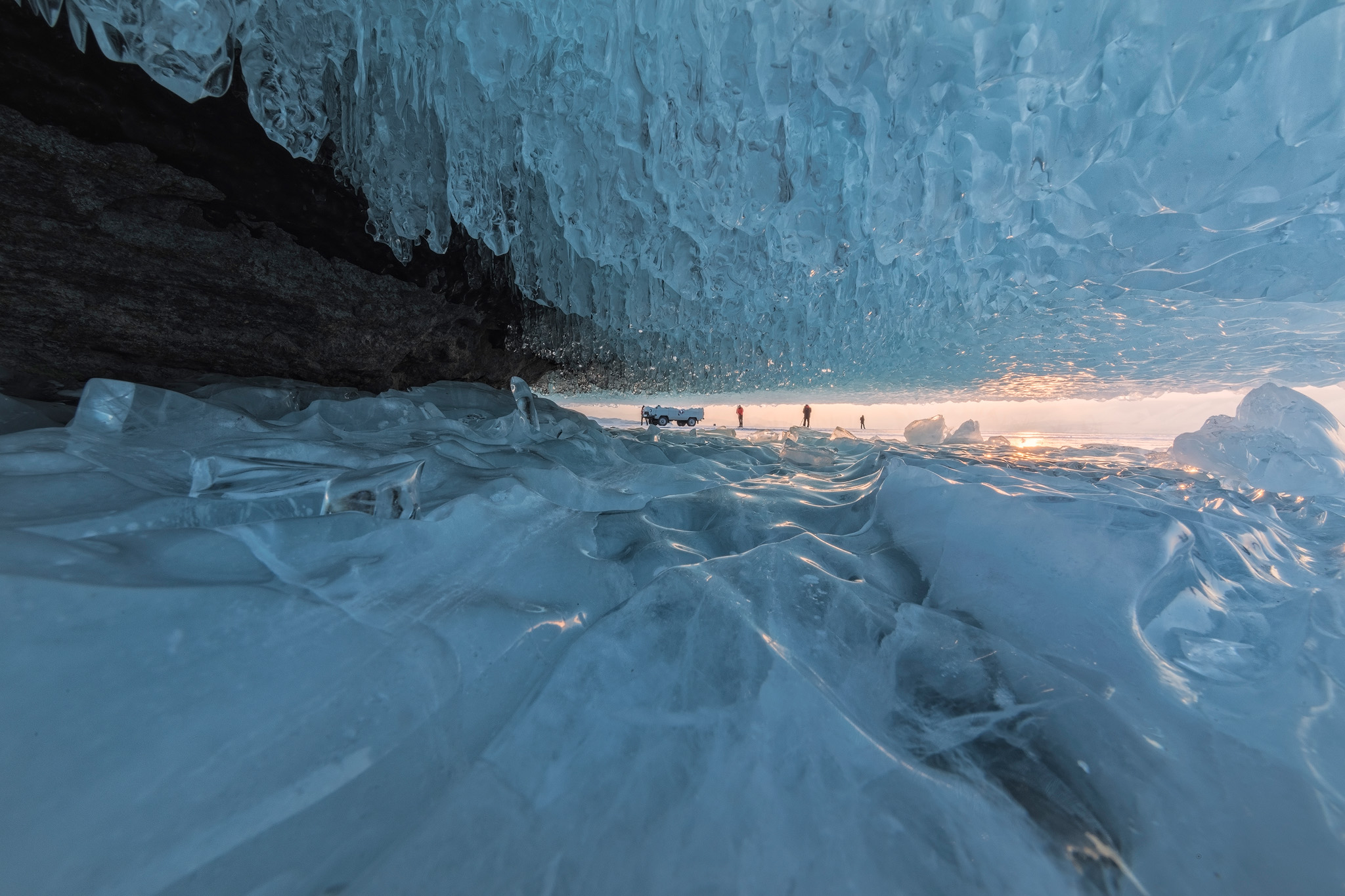 Interior of an ice cave on Lake Baikal, Siberia, in golden sunset light